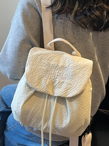 White waffle textured drawstring backpack with star embroidery for casual outdoor use