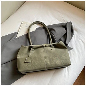 Detailed top view of a large olive green leather tote bag with stylish buckle decoration