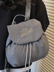 Gray textured drawstring backpack featuring YOU BEAR embroidery and adjustable straps