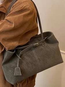 Chic dark grey oversized soft tote bag with white contrast stitching and side buckle detail