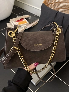 Chic dark brown suede shoulder bag with chunky gold chain and large metal ring handle