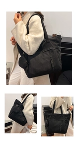 Dettaglio della borsa tote in velluto nero con pochette e cerniere in tessuto intrecciato