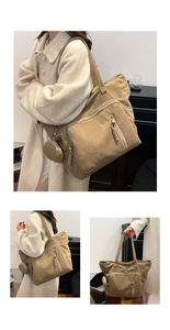 Dettaglio borsa tote in velluto a coste kaki con tasca a zip e portamonete abbinato