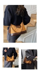Detail of vintage brown leather handbag with diamond quilted suede and gold chain strap