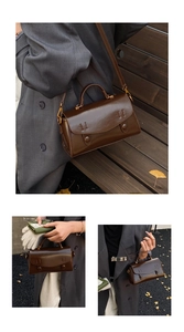 Dettaglio della borsa a scatola in pelle marrone scuro con fibbie e manico vintage