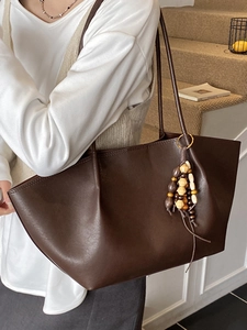 Brown oil wax leather tote bag for women with wooden bead tassel and large capacity