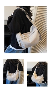 Detail view of large capacity gray nylon crossbody bag with adjustable wide strap