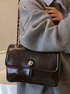 Minimalist dark brown glossy shoulder bag with metal chain and rectangular flap design