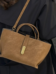 Brown suede tote bag for women with gold clasp and detachable shoulder strap in street style