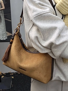 Chic camel suede underarm bag with retro fringe detail and brown leather trim for women
