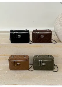 Quilted diamond pattern on various colored mini vanity cases with silver chain straps