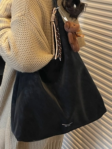 Vintage black faux suede tote bag with cute bear charm and woven rope for daily commute