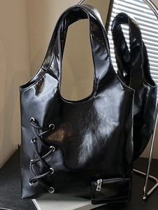 Chic black glossy large tote bag with silver grommet lacing and practical side pocket