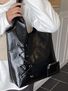 Minimalist large black PU leather tote bag with lace-up detail and matching small pouch