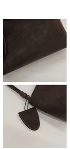 Detailed macro view of dark brown faux leather texture and fashion bag logo engraving