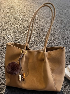 Minimalist large brown faux leather tote bag with stylish pompom and bead charm