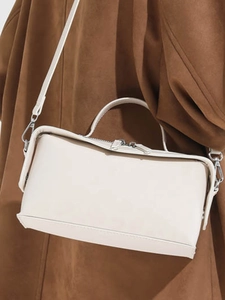 Minimalist cream leopard print box bag with smooth leather finish and silver hardware