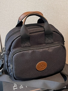 Chic black nylon square crossbody bag for women with leather handles and bicycle logo