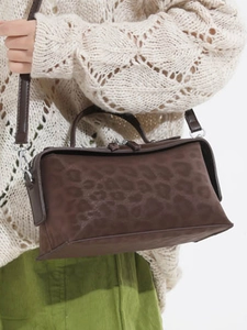 Brown leopard print suede shoulder bag with top handle and silver hardware strap