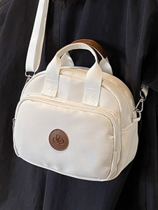 Minimalist white nylon square crossbody bag with logo patch and adjustable strap