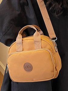 Fashionable mustard yellow nylon square crossbody bag with multi-pocket and shoulder strap