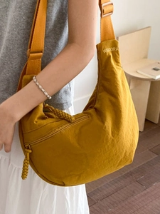 Winter mustard yellow nylon croissant tote bag with adjustable strap and embroidery