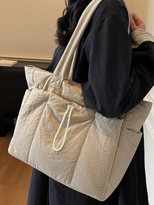 Quilted nylon tote bag for women in beige featuring a spacious design and drawstring detail