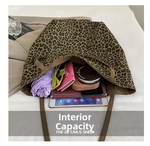Top view of spacious leopard print tote bag showing internal capacity for daily essentials