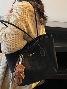 Large black matte tote bag with contrast stitching and teddy bear charm for women