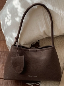 Vintage brown suede underarm bag for women with minimalist shoulder strap and retro design