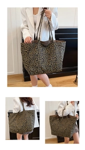 Detail of the leopard print canvas tote bag showing the spacious texture and shoulder straps