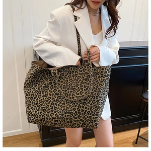 Detail of leopard print canvas tote bag featuring thick fabric and spacious interior