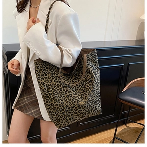 Leopard print canvas tote bag shown on a model for daily casual and work wear