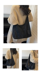 Three-way view of a black Hobo shoulder bag worn in a cozy minimalist interior
