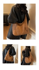Detail view of large brown suede tote bag with matching mini pouch and hobo silhouette