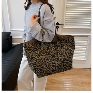 Detail of the leopard print canvas tote bag showing the large capacity and durable texture