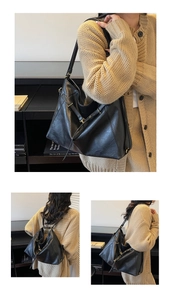 Détails du grand sac hobo noir avec boucles dorées montrant le porté épaule et à dos