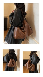 Détail du grand sac cabas en cuir marron avec sangles réglables et port polyvalent
