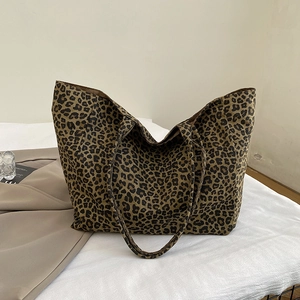 Close-up of leopard print pattern on large canvas tote bag showing soft fabric texture