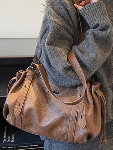Vintage brown lychee grain leather tote bag with pleated drawstring and buckle details