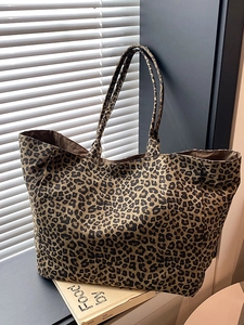 Stylish leopard print canvas tote bag with large capacity in a modern lifestyle setting