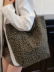 Leopard print canvas tote bag, large capacity shoulder bag for women shown on model