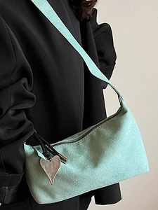 Chic mint green shoulder bag for women with minimalist design and heart pendant