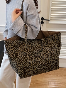 Leopard print large canvas tote bag for women showing a stylish shoulder carry style