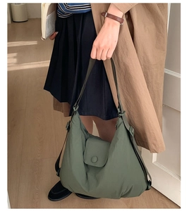 Detail of army green large capacity nylon tote bag with wide adjustable shoulder strap
