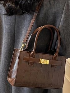 Chic dark brown crocodile embossed crossbody bag with gold lock and top handles