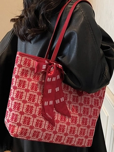 Minimalist red tote bag with festive Double Happiness jacquard and ribbon detail