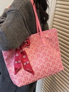 Pink minimalist tote bag with red Xi character jacquard and festive silk bow accessory