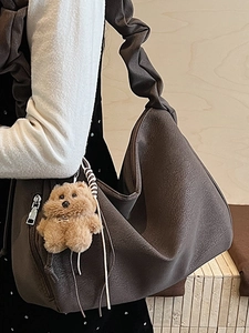 Fashionable dark coffee pleated cloud shoulder bag with a cute plush bear charm