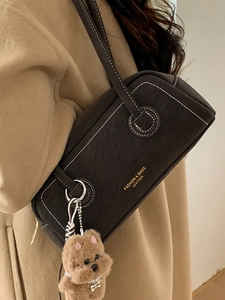 Retro brown suede Boston bag with white contrast stitching and cute plush bear charm